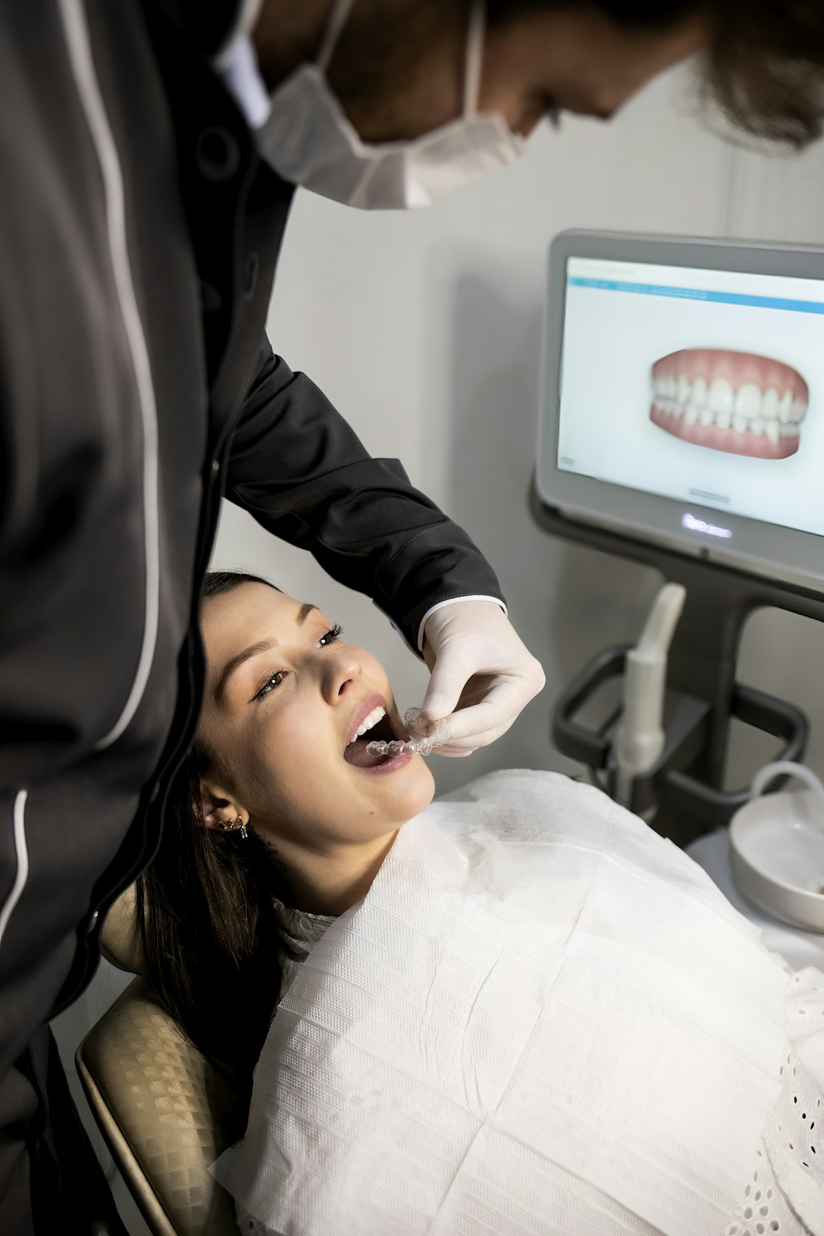 Dentist reviewing a digital scan with a patient at Maple Grove Dental
